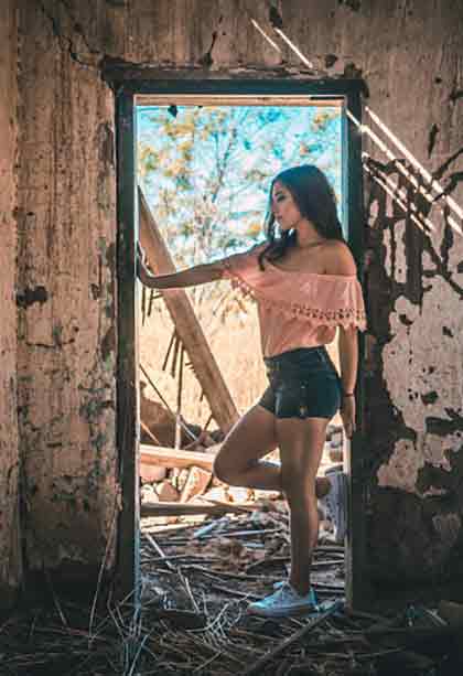  A photo of one of the most beautiful Colombian women standing on ruins.